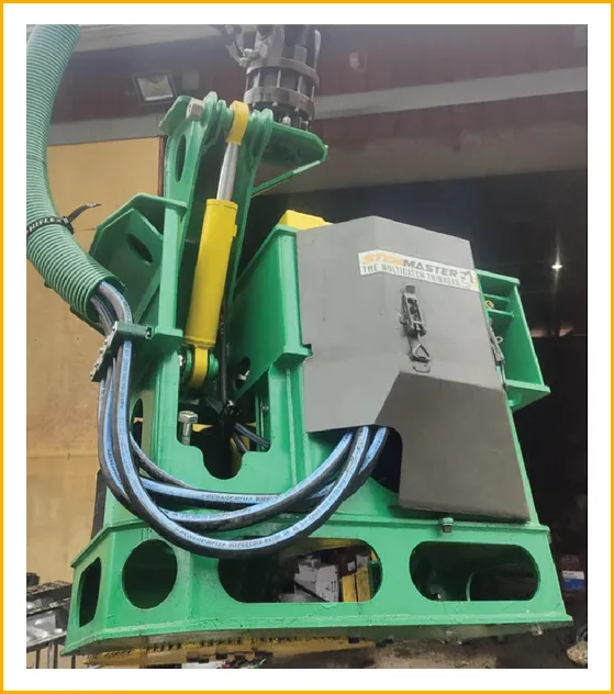 Close-up of the StemMaster green and yellow head assembly with hydraulic detail